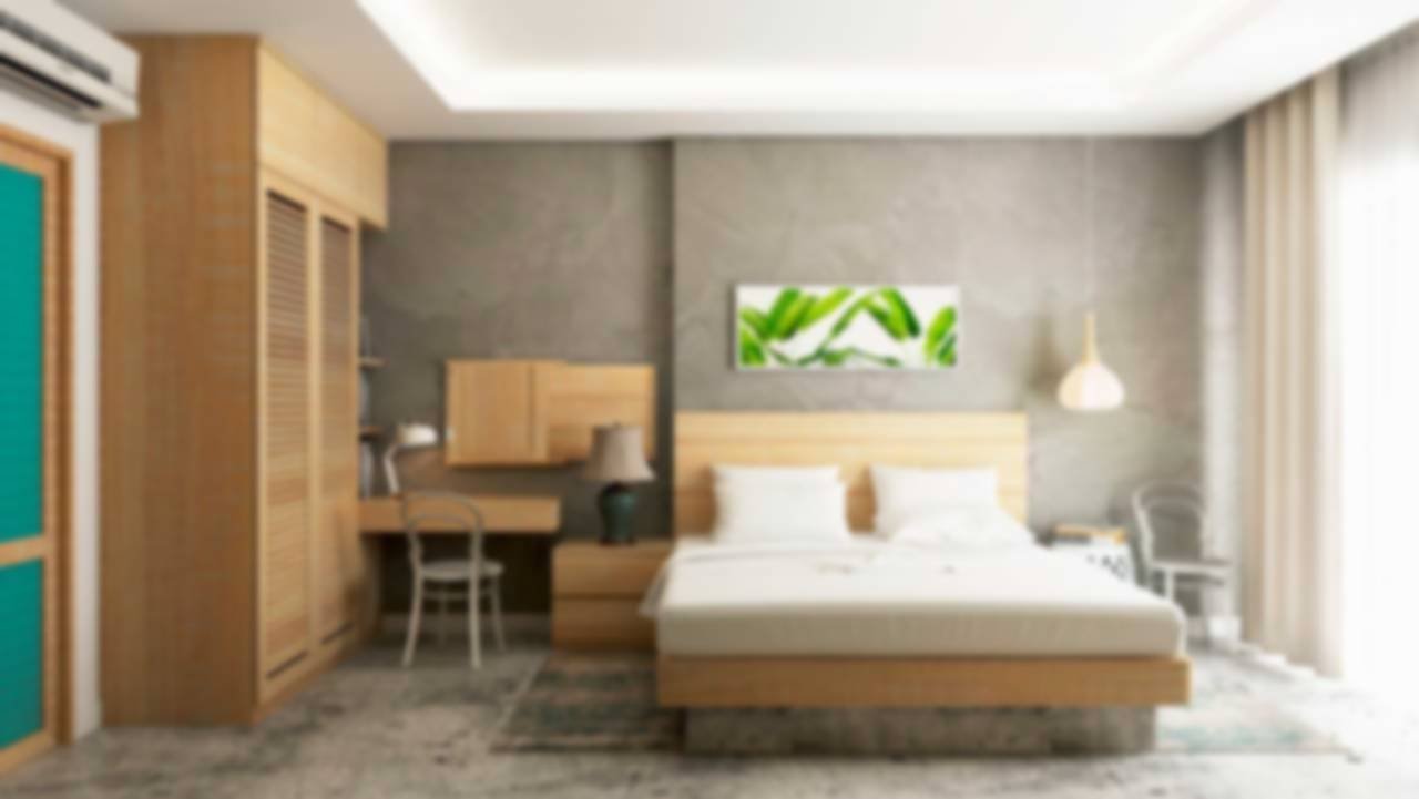 Quarto com cama e decoração verde